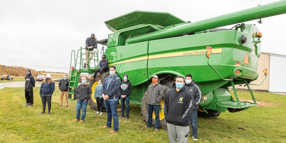 The S660 combine and corn head, donated by John Deere, allows staff and students to harvest corn and soybean research plots more efficiently.