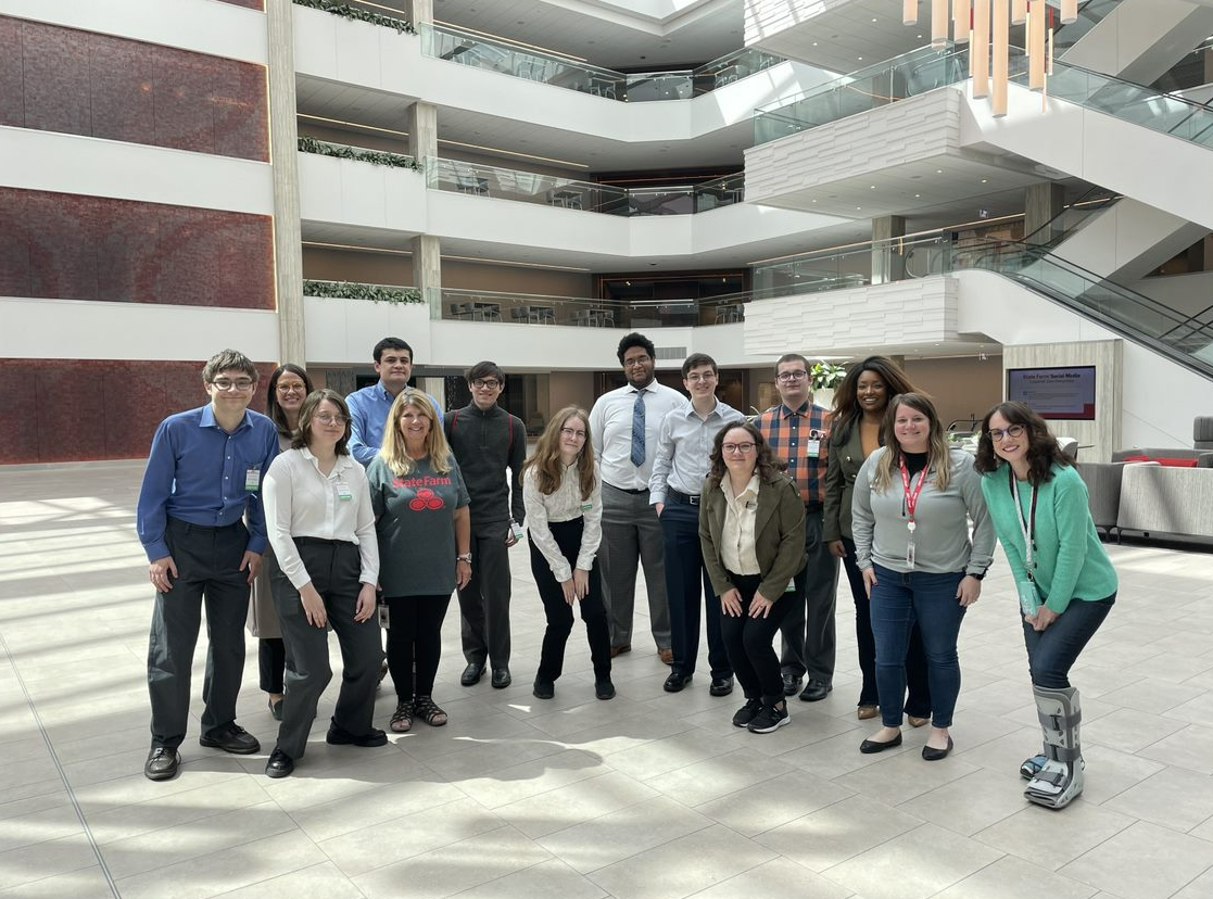 Students and State Farm employees pose in the Atrium
